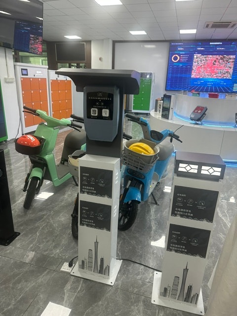 Electric scooter swap station showroom with kiosk